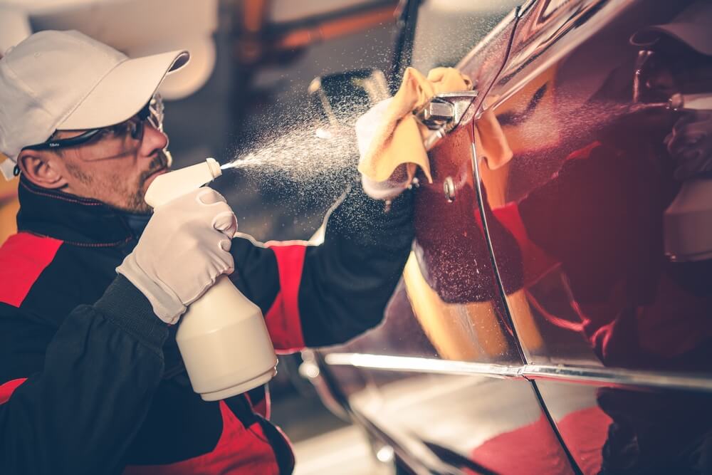 man doing car detailing