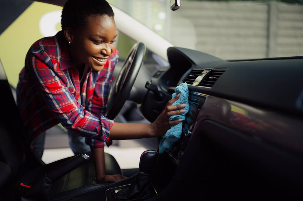 woman doing interior car detailing